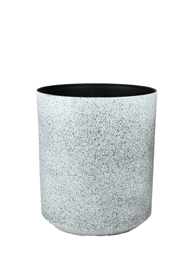 High-angle view of a speckled white planter with a minimalist cylindrical design, featuring a smooth matte finish and subtle texture. Its neutral tones complement various indoor and outdoor settings.